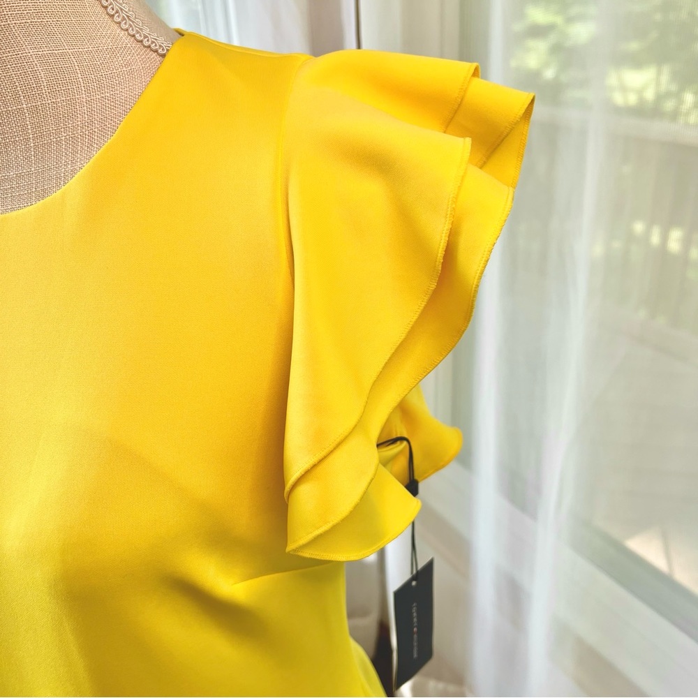 Tommy Hilfiger Scuba Crew Neck Flutter Ruffle Cap Sleeve Dress
Yellow Size 8 NWT - Picture 12 of 16